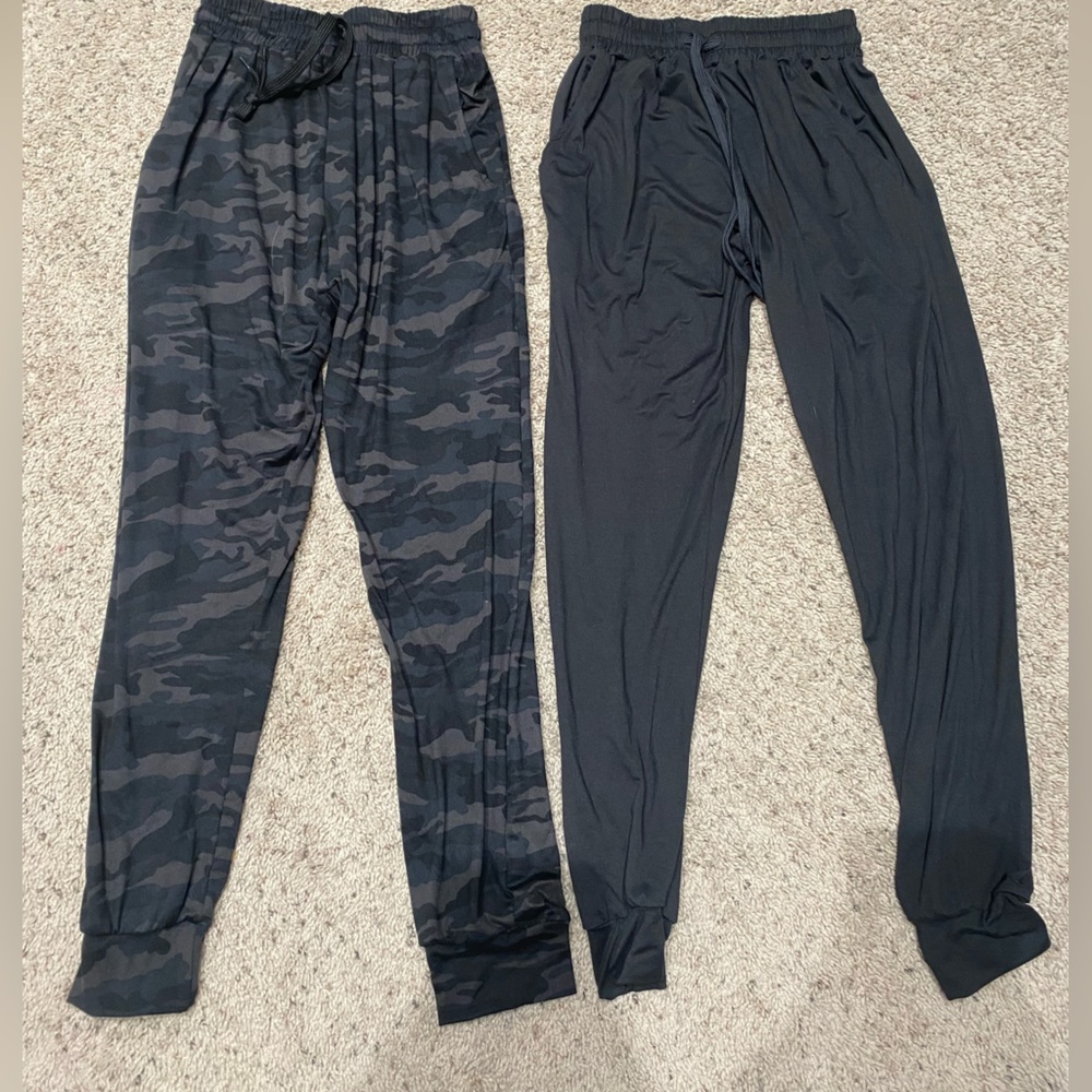 two womens joggers from the brand real essentials, they are both a size small.
